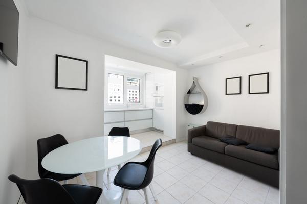 Modern Apartment Interior with white walls, black accents and furniture